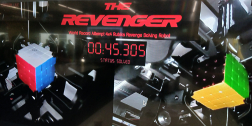 The Revenger robot solves a 4x4 Rubik’s Cube in 45.305 seconds, as shown on a display labeled ‘World Record Attempt.